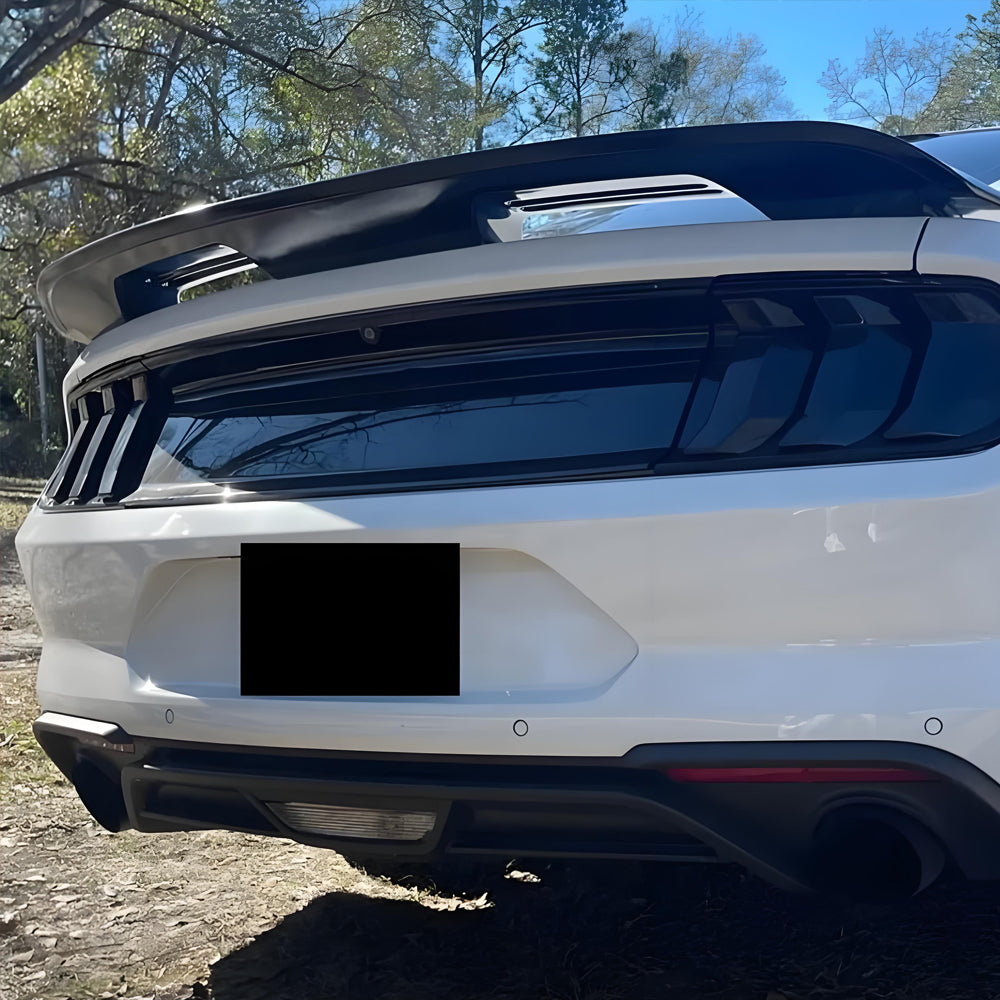 Display of White Ford Mustang with Carbon Fiber-Look Rear Spoiler
